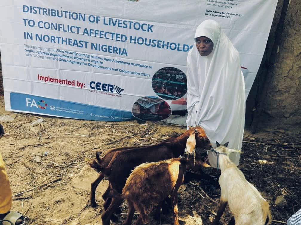 A livestock-support participant with goats received through a CEER programme